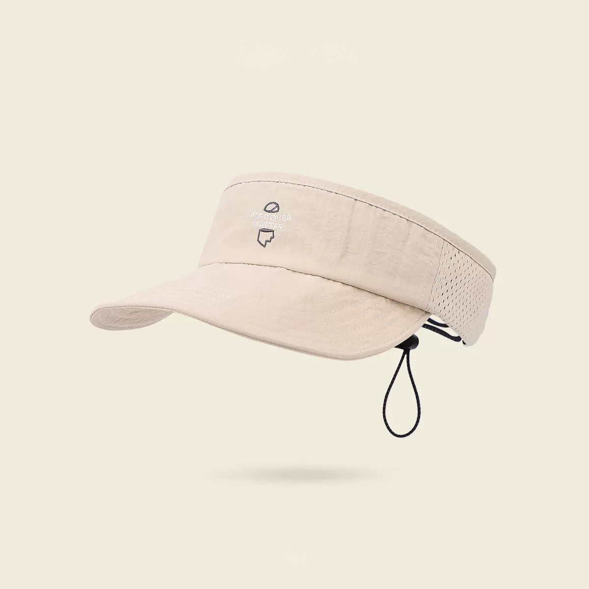 Beige visor cap with a small logo on a beige background