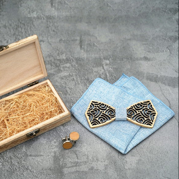 Wooden jewelry box with decorative wooden earrings on a gray surface.