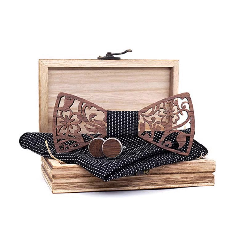 Wooden bow tie set with decorative patterns on a wooden box