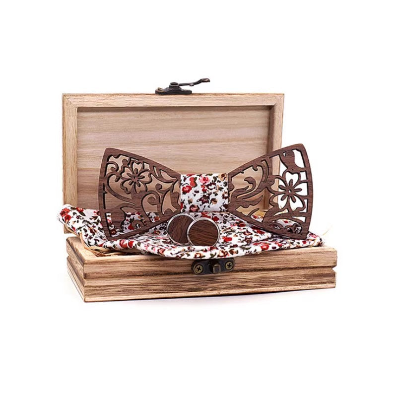 Wooden bow tie with floral pattern on a wooden box