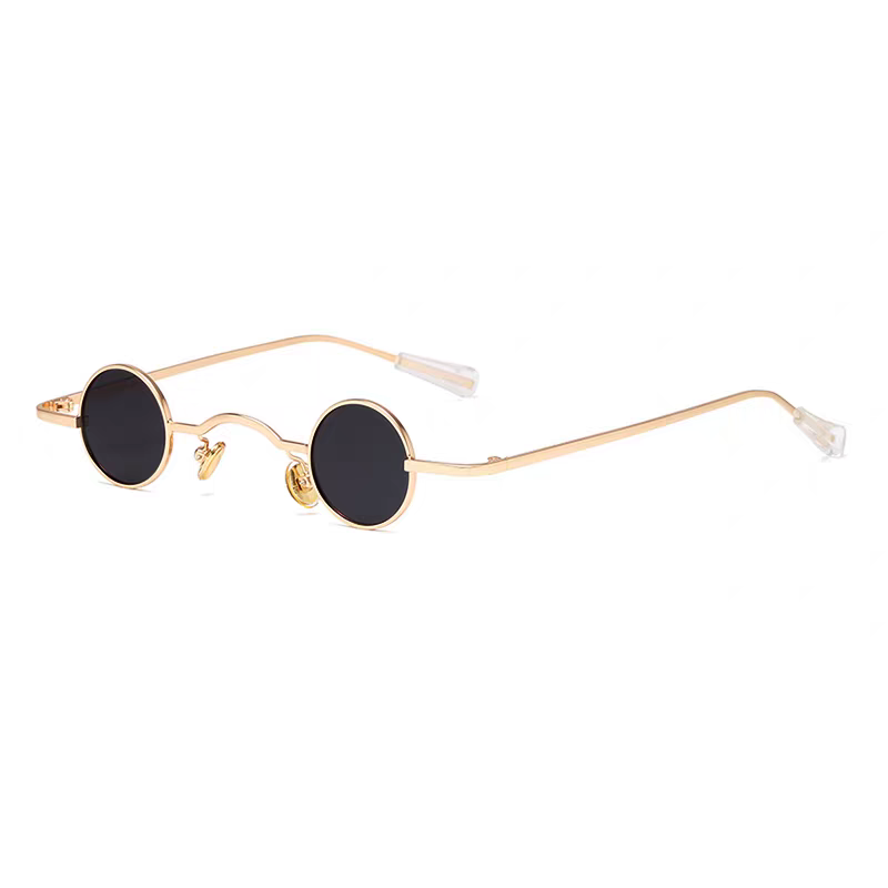 Small round sunglasses with gold frame and black lenses on a white background.