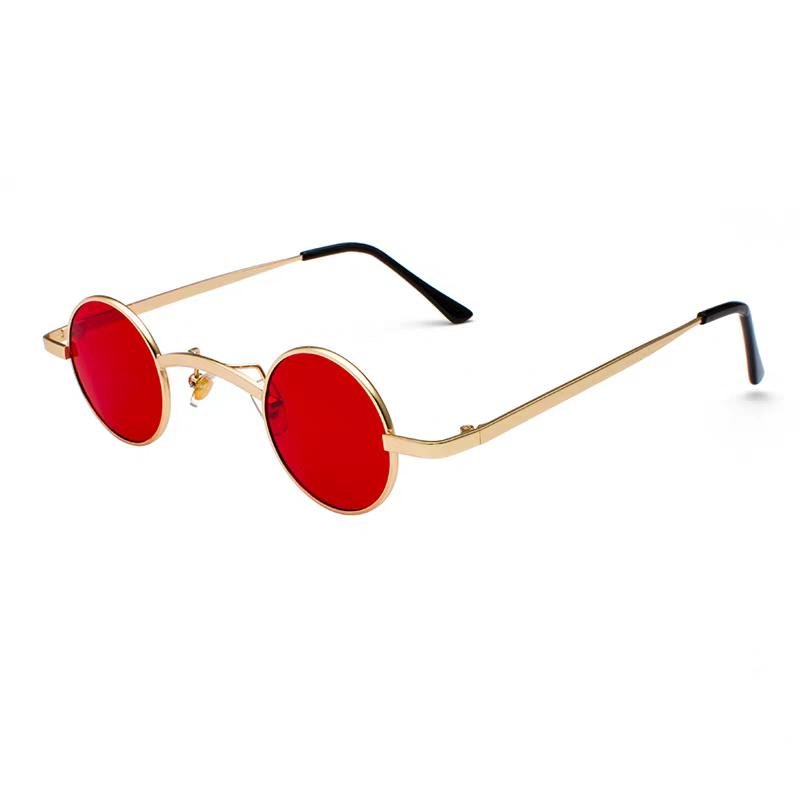 Sunglasses with gold frame and red lenses on a white background.