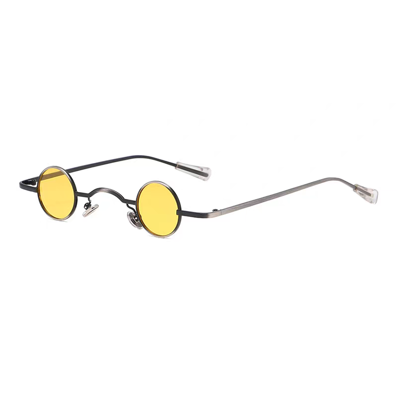 Round sunglasses with yellow lenses and black frames on a white background.