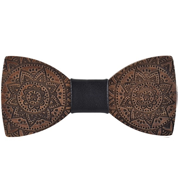 Wooden bow tie with intricate patterns on a white background