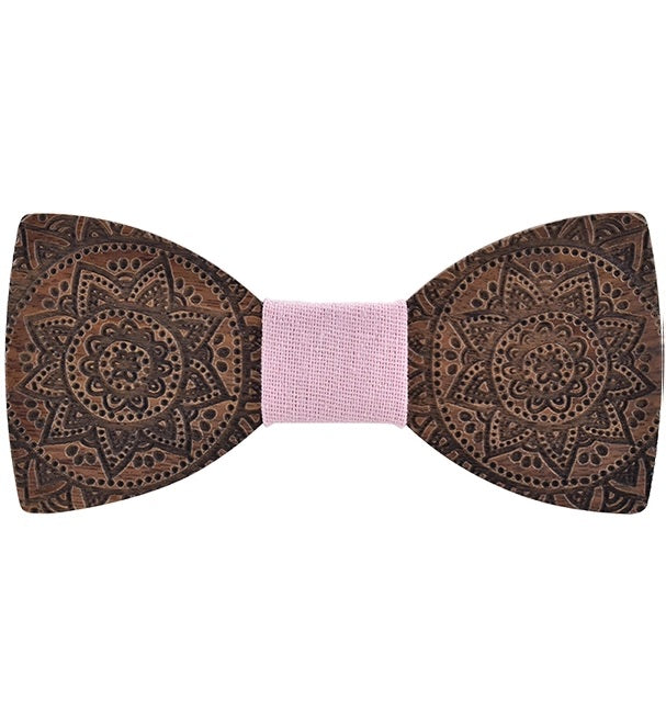 Wooden bow tie with intricate patterns on a white background