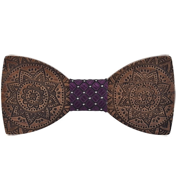 Wooden bow tie with intricate patterns on a white background