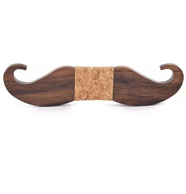 Wooden mustache-shaped object with cork center on a white background