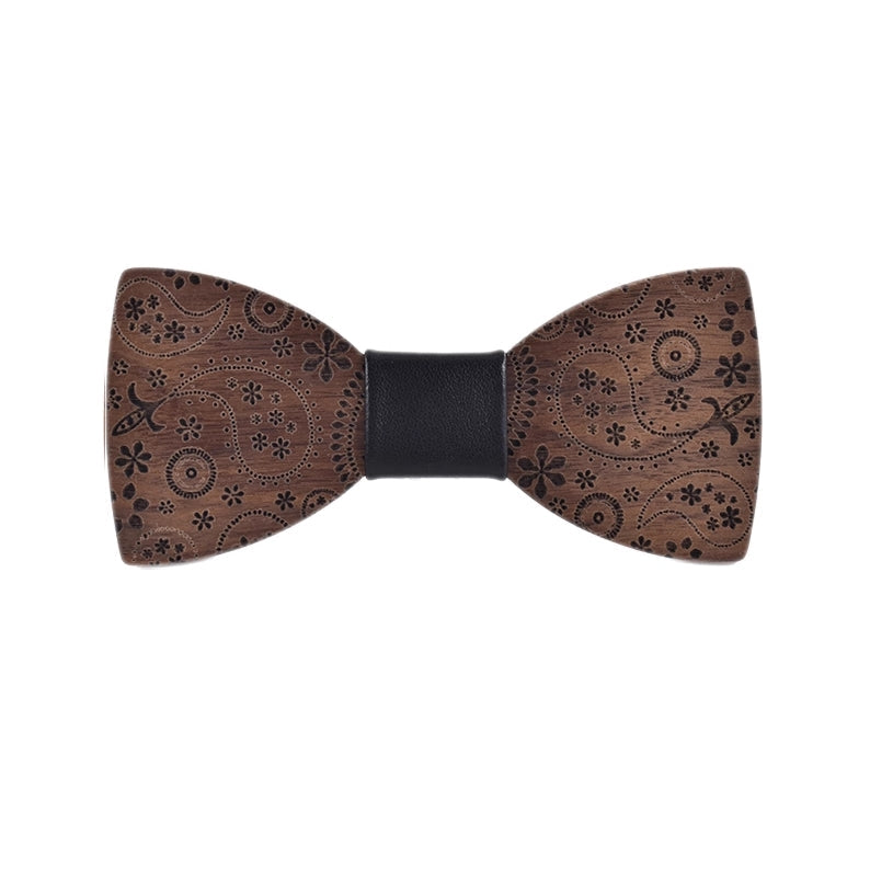 Wooden bow tie with intricate patterns on a white background