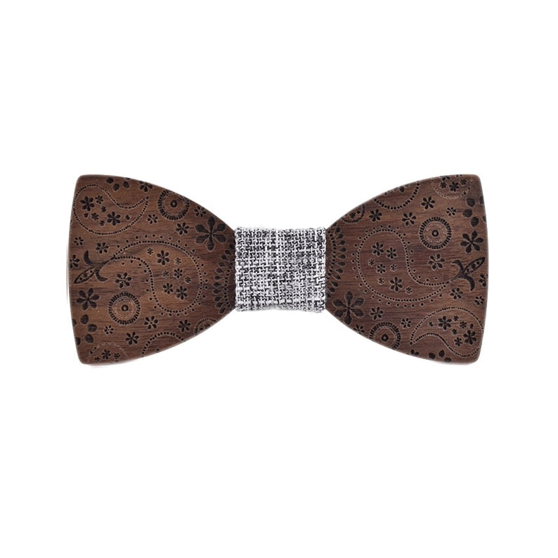 Wooden bow tie with intricate patterns on a white background