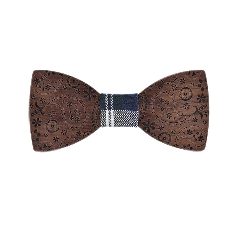 Wooden bow tie with decorative patterns on a white background