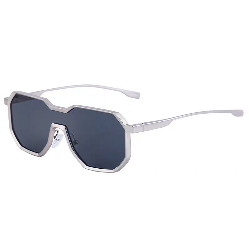 Silver sunglasses with dark lenses on a white background