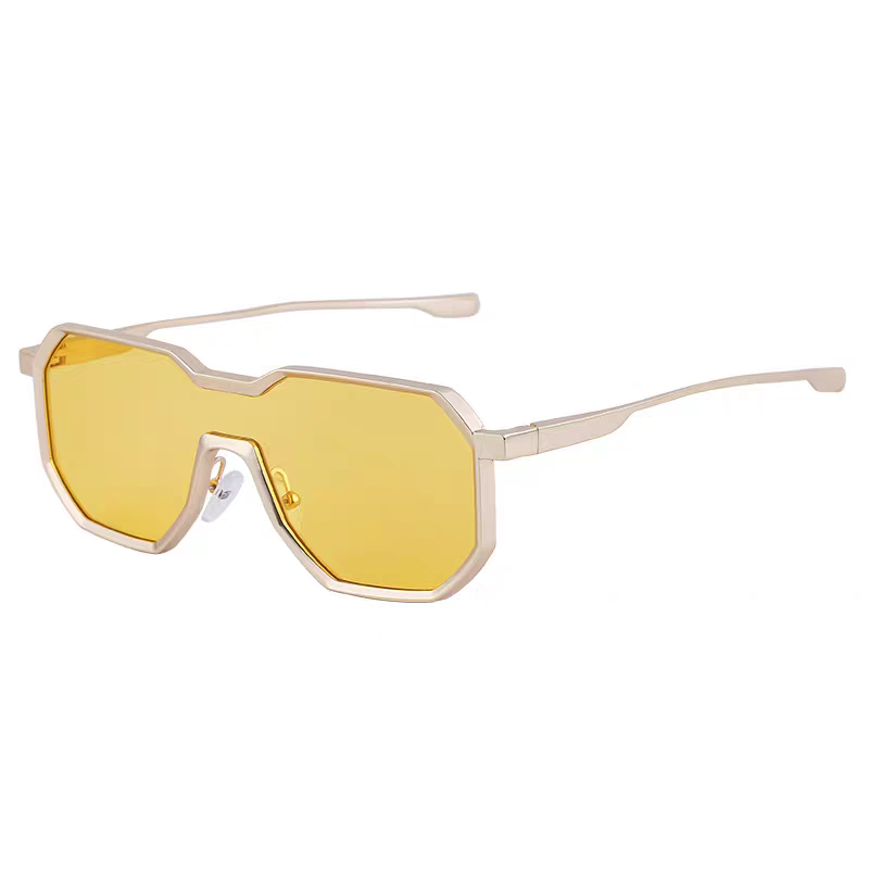 Sunglasses with yellow lenses and gold frames on a white background