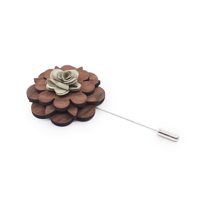 Wooden flower lapel pin with a metal pin on a white background