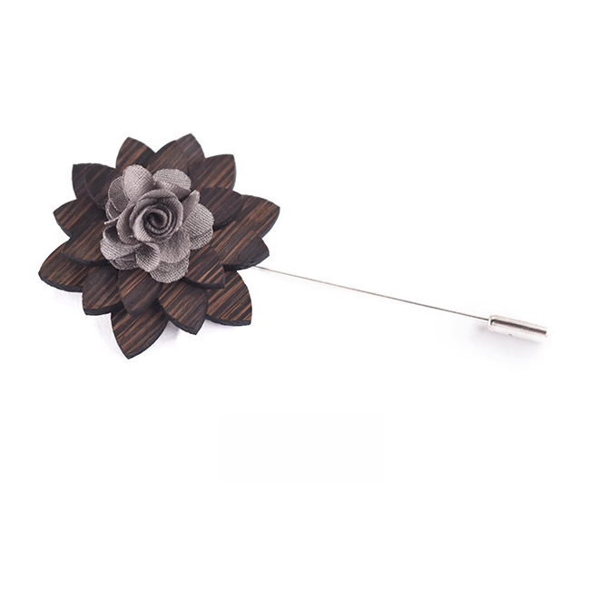 Wooden flower lapel pin on a white background