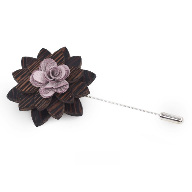 Wooden flower lapel pin with a pink center on a white background