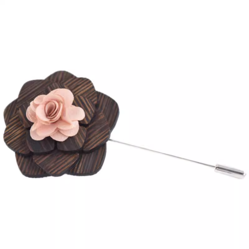 Floral lapel pin with brown and pink flower on a white background