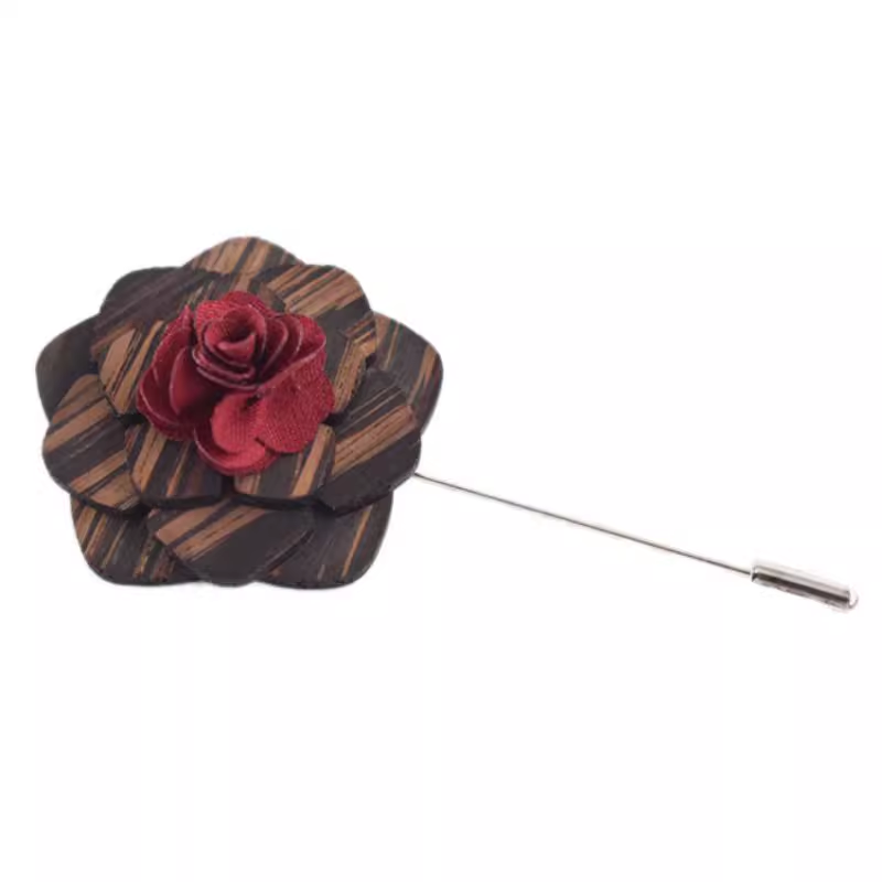 Floral lapel pin with red flower and brown striped casing on a white background
