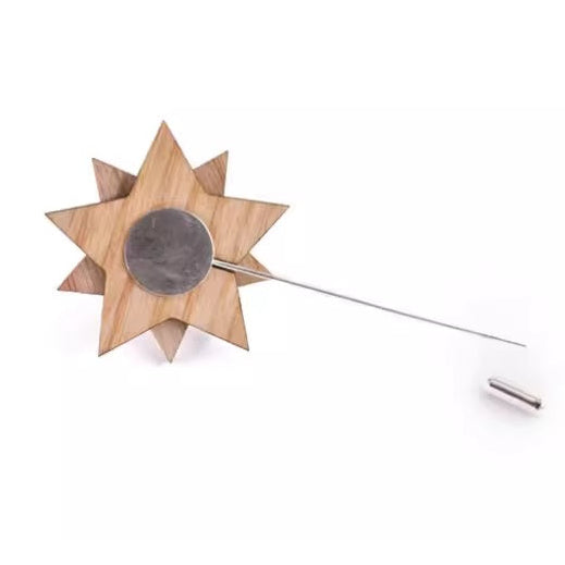 Wooden star-shaped lapel pin on a white background