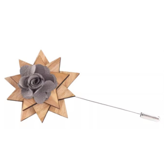 Wooden star-shaped brooch with a gray flower on a white background