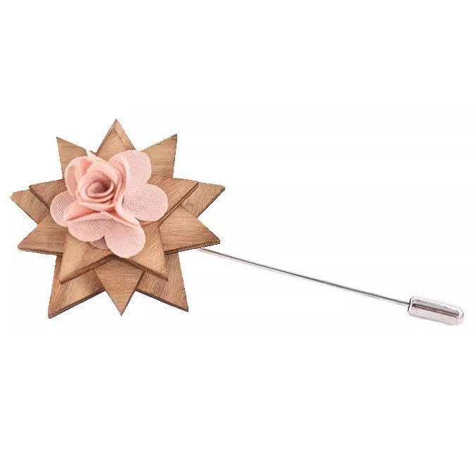 Wooden flower lapel pin with pink center on a white background
