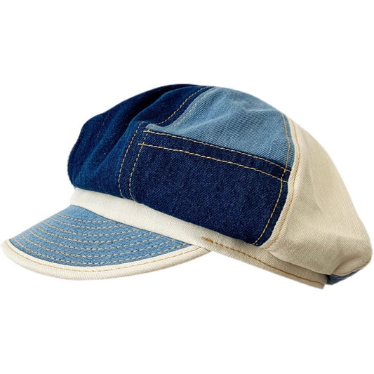 Two-tone blue and beige cap on a white background