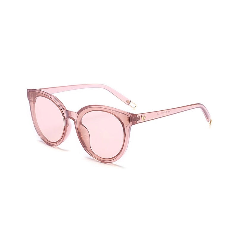 Pink sunglasses with a clear frame on a white background