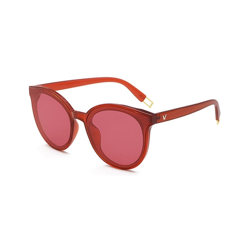 Red sunglasses with a gold logo on a white background