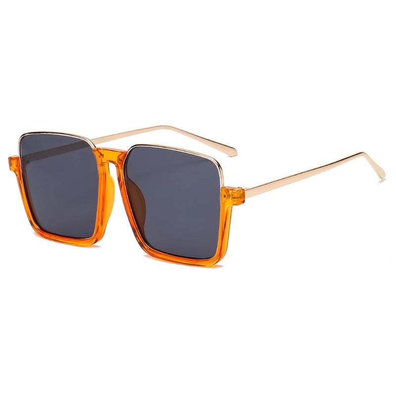 Sunglasses with orange frame and dark lenses on a white background