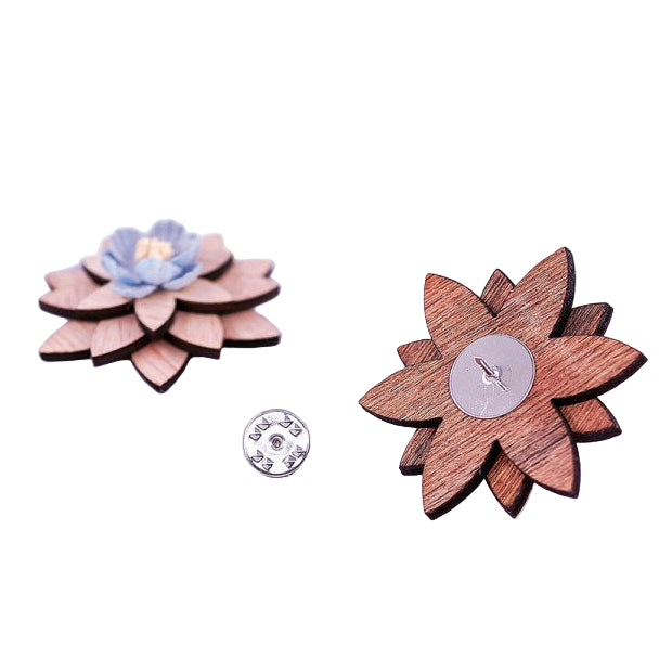 Wooden flower-shaped pins on a marble surface with text overlay
