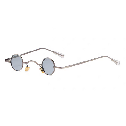 Round sunglasses with thin frame and gold accents on a white background