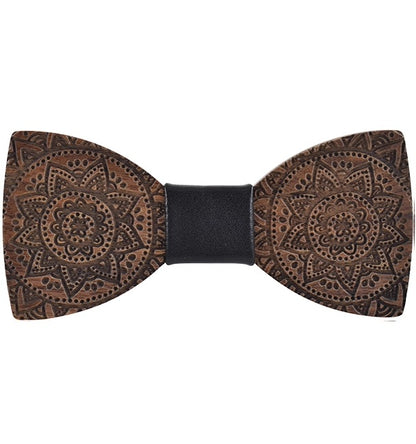 Wooden bow tie with intricate patterns on a white background
