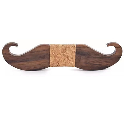 Wooden mustache-shaped object with cork center on a white background