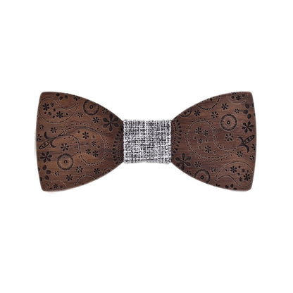 Wooden bow tie with intricate patterns on a white background