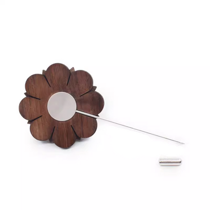 Wooden flower-shaped lapel pin on a white background