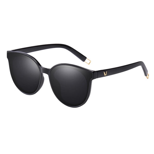 Black sunglasses with gold accents on a white background
