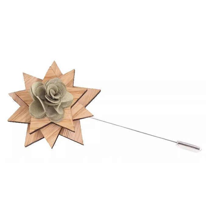 Wooden lapel pin with a floral design on a white background