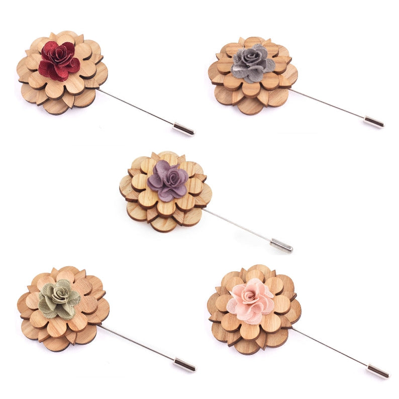 Set of five floral lapel pins on a white background